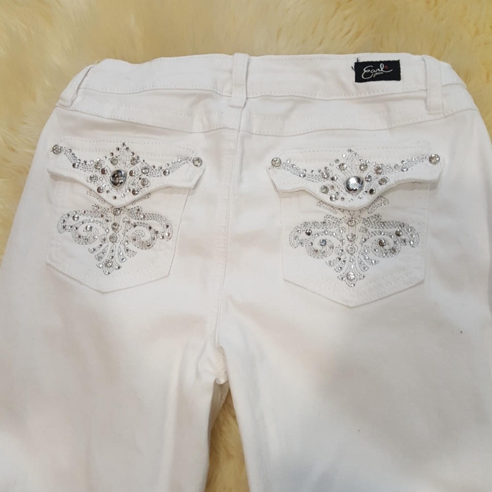 Like new white pair of diamond studd jeans